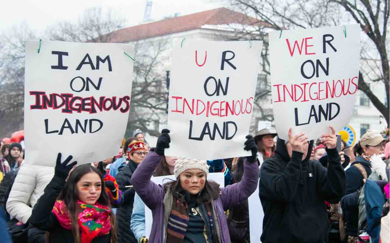 indigenous-people-at-a-protest-with-22Landback22-signs.jpeg